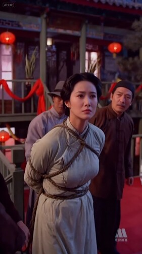 jimeng-2025-09-09-3825-根据这个图片生成更清晰的照片,保持女人双手束缚在背后的姿势,保留绳子,女人沉默挣...